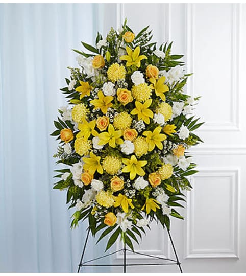 Yellow and White Sympathy Standing Spray. An arrangement by Graceland Florist.