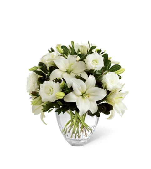 The FTD® White Elegance™ Bouquet. An arrangement by Country Cousins Flower Shop.