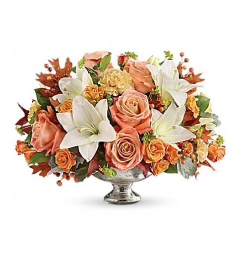 Teleflora's Harvest Shimmer Centerpiece. An arrangement by Fabulous Flowers.