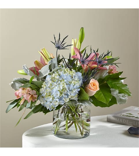 Lost in Paradise Bouquet by FTD. An arrangement by Country Cousins Flower Shop.