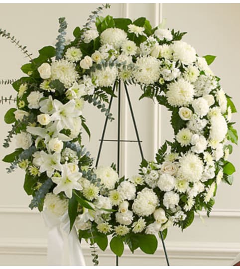 All White Standing Wreath. An arrangement by Graceland Florist.