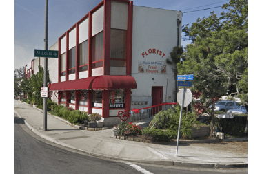 Signal Hill Florist florist arranging flowers
