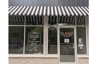 Blumz Floral Boutique florist arranging flowers
