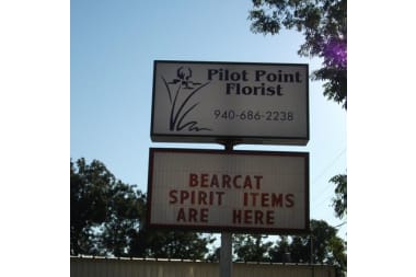 Pilot Point Florist florist arranging flowers