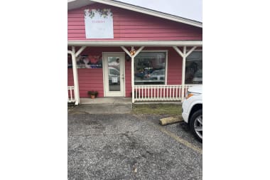 Beez Flower & Gift Shop florist arranging flowers