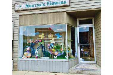 Norton's Flowers & Gifts florist arranging flowers