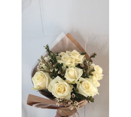 12 White Roses Wrapped