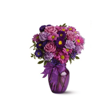 ASSORTED PURPLE FLOWERS ARRANGED