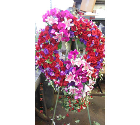 red roses purple lisianthus open wreath