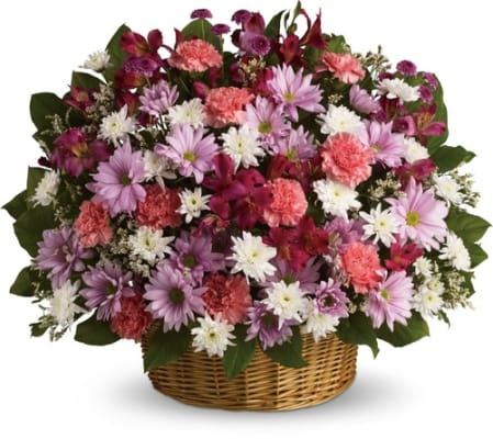 THREE-SIDED ARRANGEMENT OF ASSORTED DAISIES IN WIDE BOTTOM BASKET