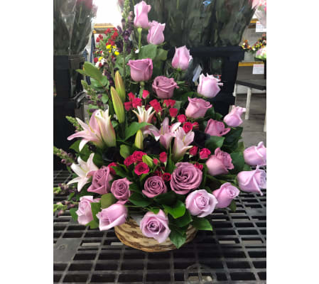 A Sympathy Basket with Shades of Purple Roses