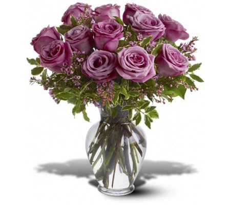 1 DOZEN PURPLE ROSES IN VASE WITH GREENS AND FILLER