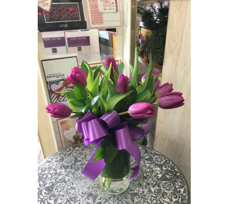 Purple Tulips in clear vase by Vivian