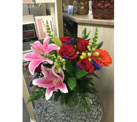 Brighten lovely flowers in vase by Vivian