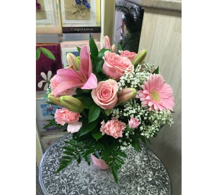 pink flowers in pink vase by Vivian