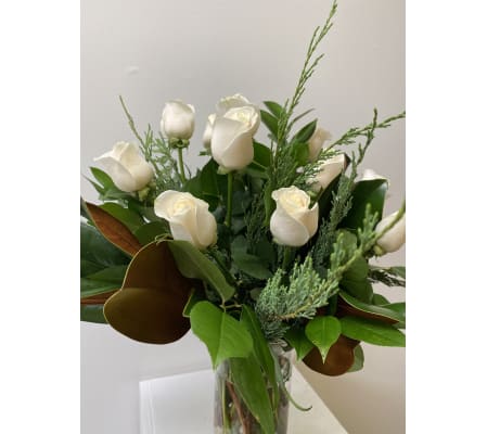 12 white roses arranged for Christmas