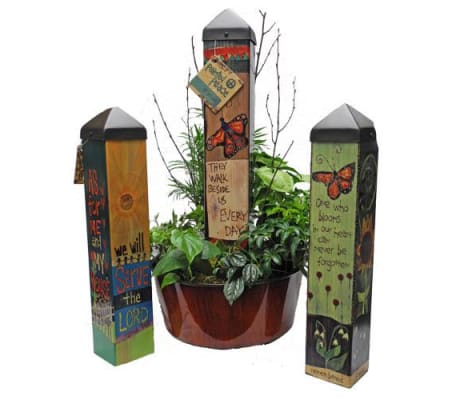 GARDEN ART POLE IN GREEN PLANT