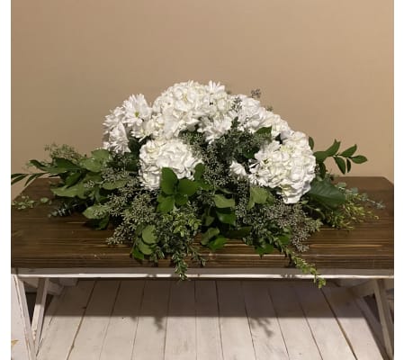 Greens and white hydrangea casket spray