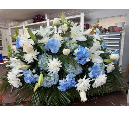 Beautifully Blue Sympathy Half Casket Spray