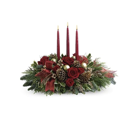Centrepiece featuring red flowers with gold accents.