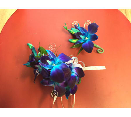blue set of corsage and boutonniere