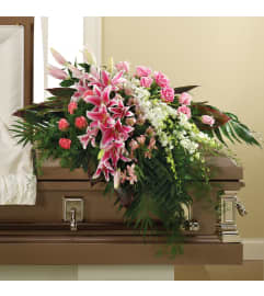 PINK LILIES AND PINK ROSES CASKET COVER. An arrangement by Heavenly Flowers.