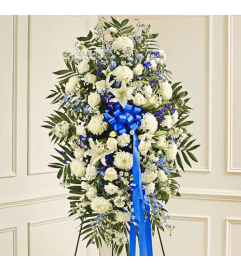 BLUE AND WHITE STANDING SPRAY. An arrangement by Heavenly Flowers.