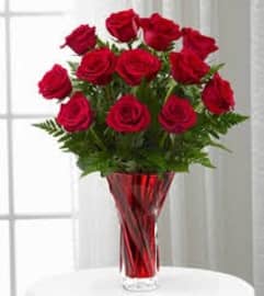 She likes Reds. An arrangement by Flowers By Stephanie.