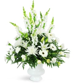 Peaceful White Tribute. An arrangement by Floral Boutique. Peaceful White Tribute. An arrangement by Floral Boutique.