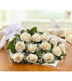 Perfectly wrapped white roses. An arrangement by Loyalist Flowers.