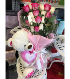 Hand-tied Bouquet with Teddy Bear. An arrangement by Flamingo Floral and Gifts.