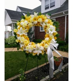 Golden Life Wreath. An arrangement by Violeta's Flower Shop.