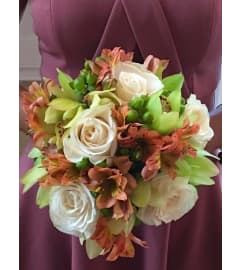HANDTIED BOUQUET OF MUTED FLOWERS. An arrangement by Flowers by Priscilla.