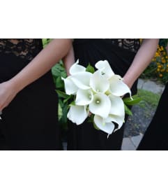 HANDTIED OF WHITE CALLA LILIES. An arrangement by Flowers by Priscilla.