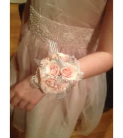WRIST CORSAGE OF ANY COLOR. An arrangement by Flowers by Priscilla.