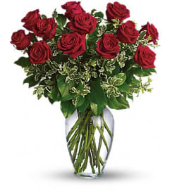Red roses arranged. An arrangement by Anthurium Gardens Florist.