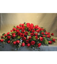 ROSE CASKET SPRAY. An arrangement by J.D. Ballantine's Flowers and Gifts. ROSE CASKET SPRAY. An arrangement by J.D. Ballantine's Flowers and Gifts.