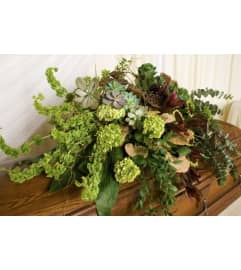NATURAL CASKET SPRAY. An arrangement by J.D. Ballantine's Flowers and Gifts. NATURAL CASKET SPRAY. An arrangement by J.D. Ballantine's Flowers and Gifts.