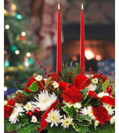 DOUBLE CANDLE CENTERPIECE. An arrangement by J.D. Ballantine's Flowers and Gifts.