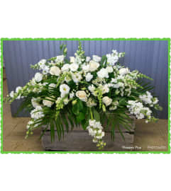 Always In My Heart Casket Spray. An arrangement by Flowers Plus.