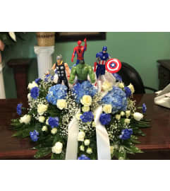 SUPER HERO CASKET. An arrangement by Bertha's Florist.