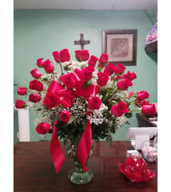 4 Dozen Of Roses. An arrangement by Bertha's Florist. 4 Dozen Of Roses. An arrangement by Bertha's Florist.