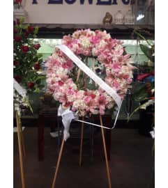 funeral wreath. An arrangement by Commerce Flowers.