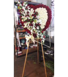red and white heart. An arrangement by Commerce Flowers.