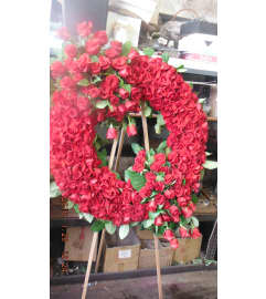 all red rose wreath2. An arrangement by Commerce Flowers.