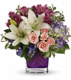 Garden Romance TEV20-1. An arrangement by Jennifer's Flowers and Gifts.