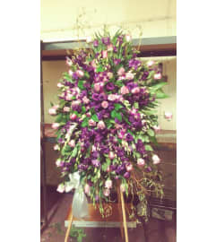 purple and lavender spray. An arrangement by Commerce Flowers.
