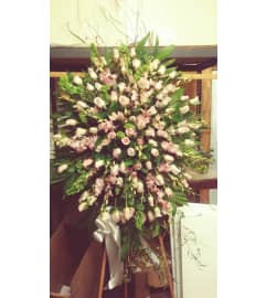 white and light pink spray. An arrangement by Commerce Flowers.