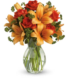 Fiery Lilies and Roses. An arrangement by Chelsea Florist, Inc.