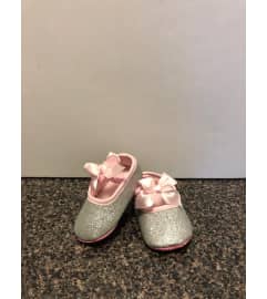 Baby Girl Shoes. An arrangement by Flamingo Floral and Gifts.
